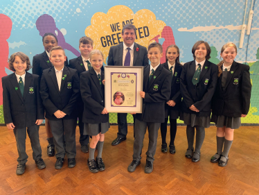 Stephen greets pupils and presents them with a Platinum Jubilee Certificate