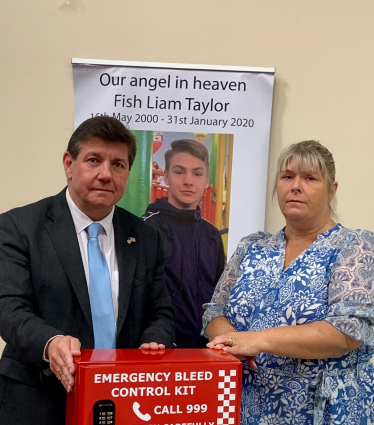 Stephen Metcalfe and Julie Taylor stand by one of the Liam Taylor Legacy Bleed Control Kits.